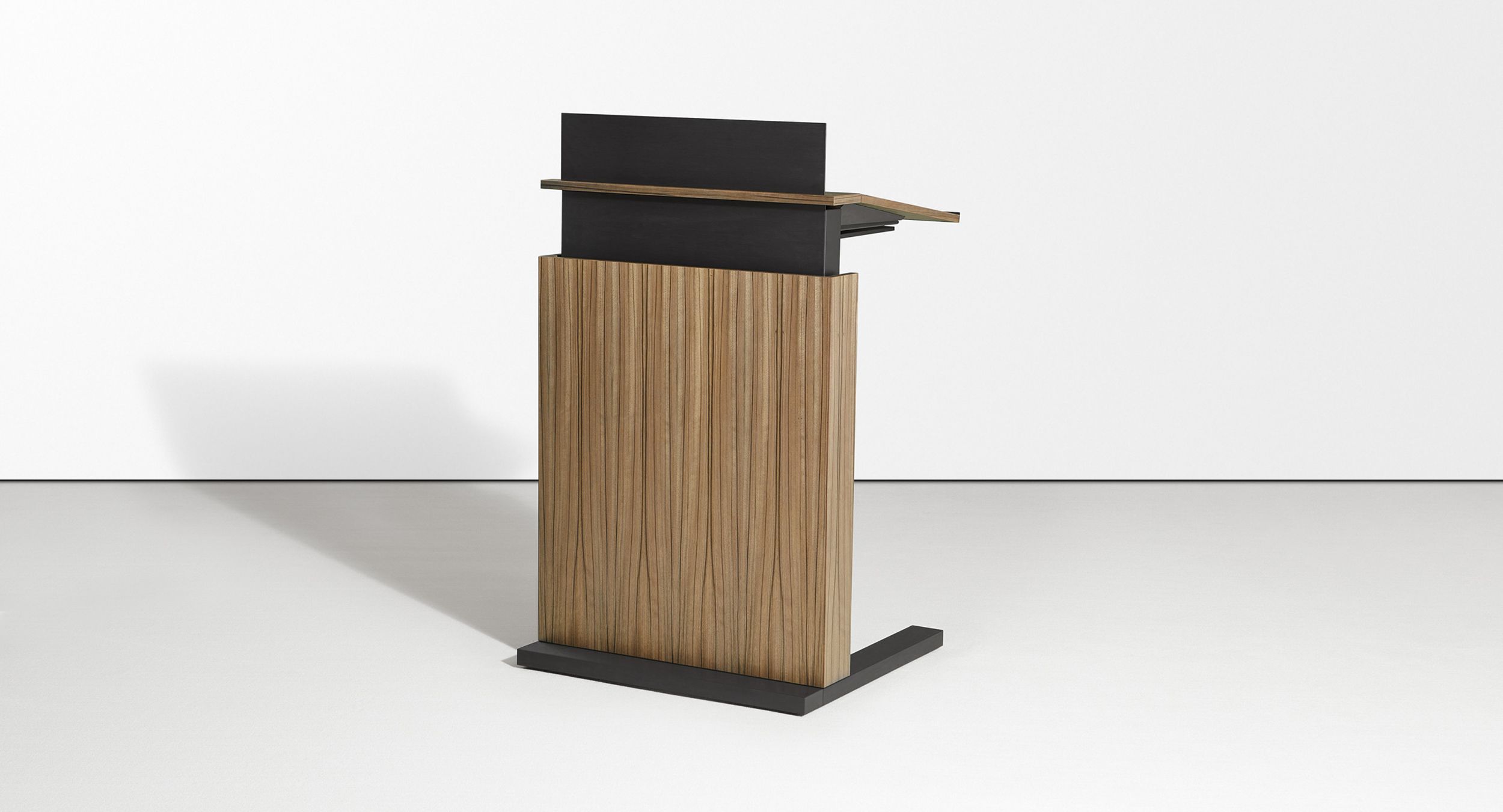 The Motus adjustable-height mobile lectern accommodates  presenters of every height with a push of a button.