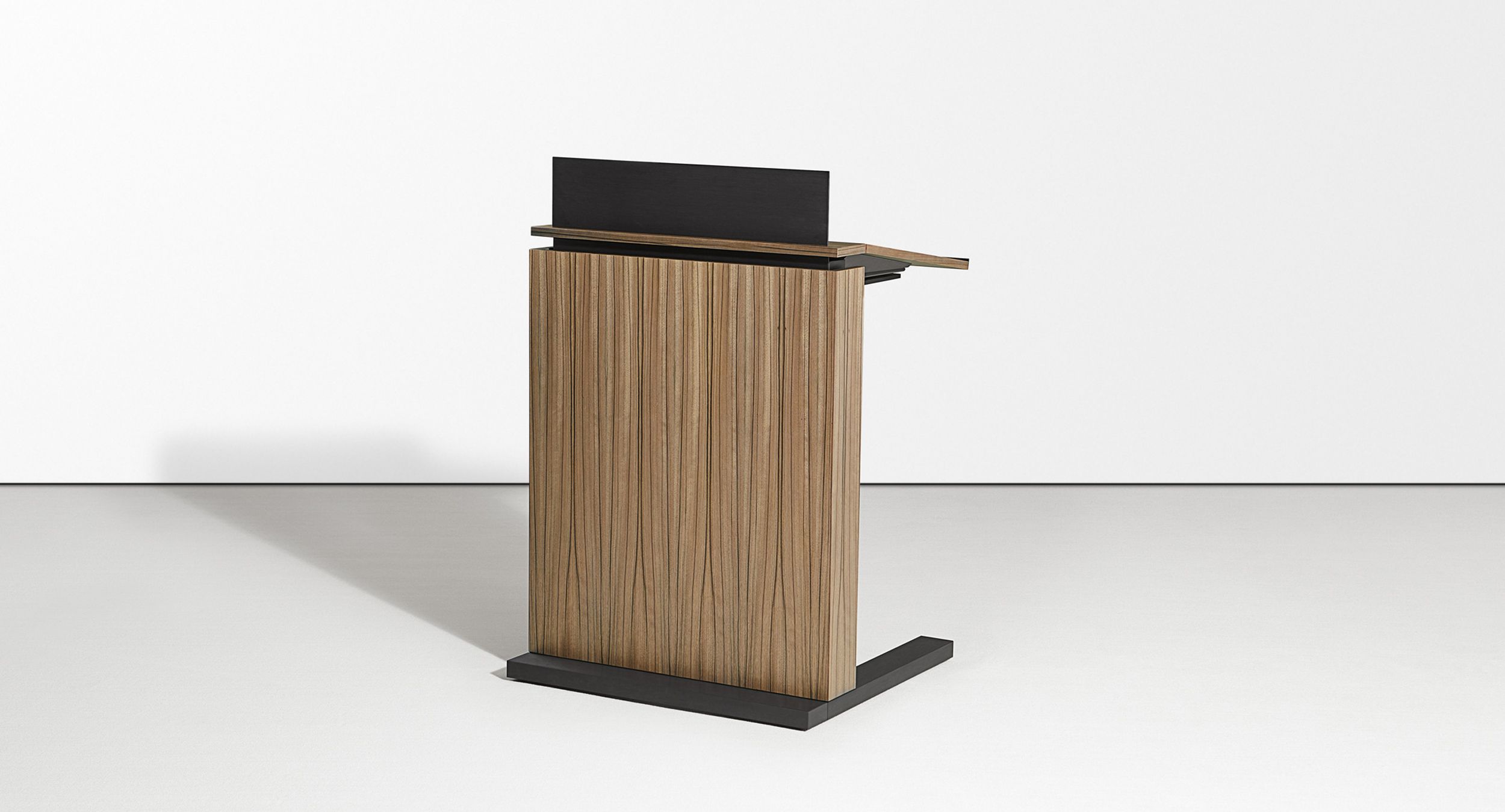 The Motus adjustable-height mobile lectern accommodates  presenters of every height with a push of a button.