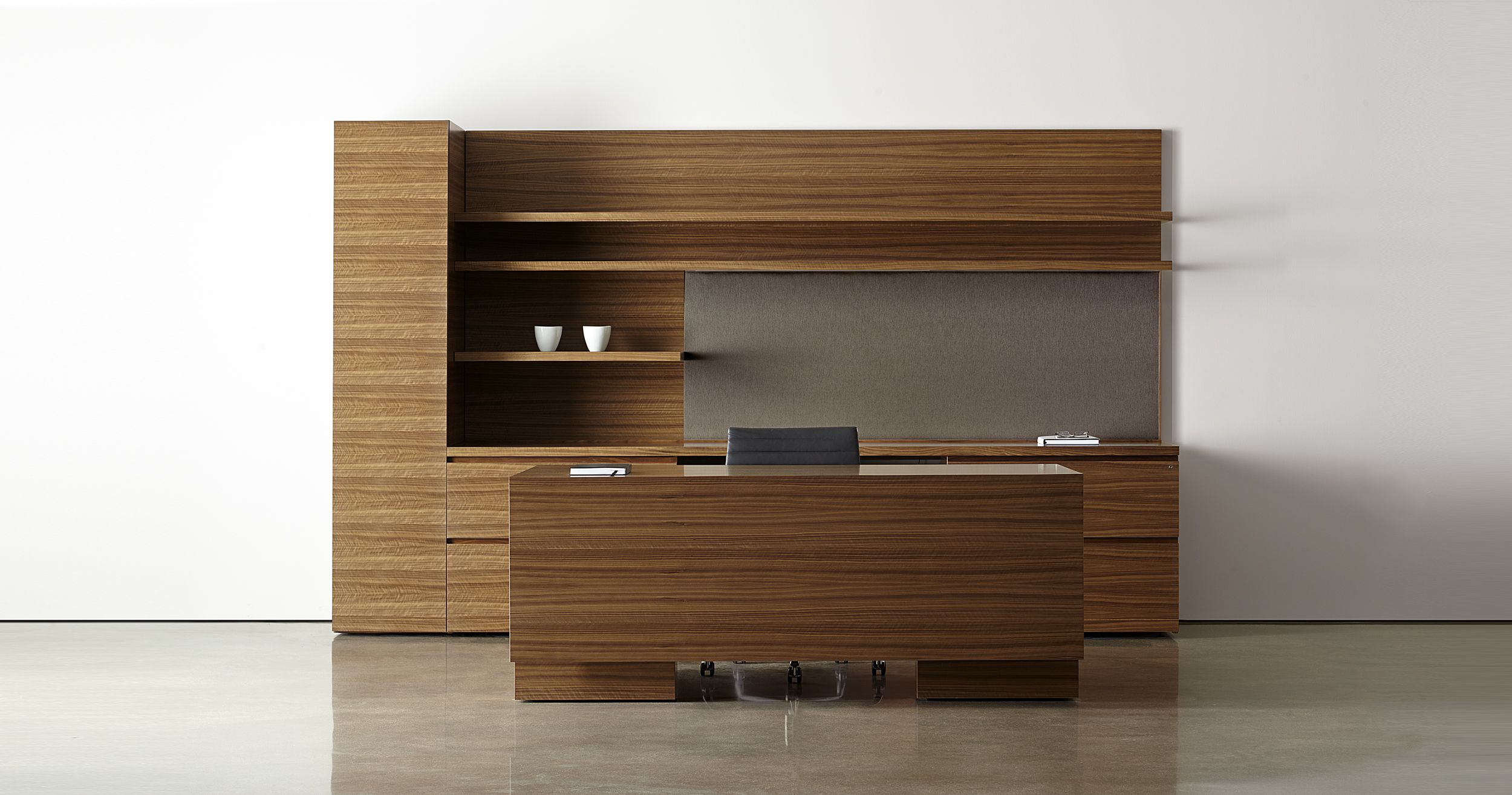New Millennia features clean lines, perfectly matched veneers, and stunning adjustable-height desks.