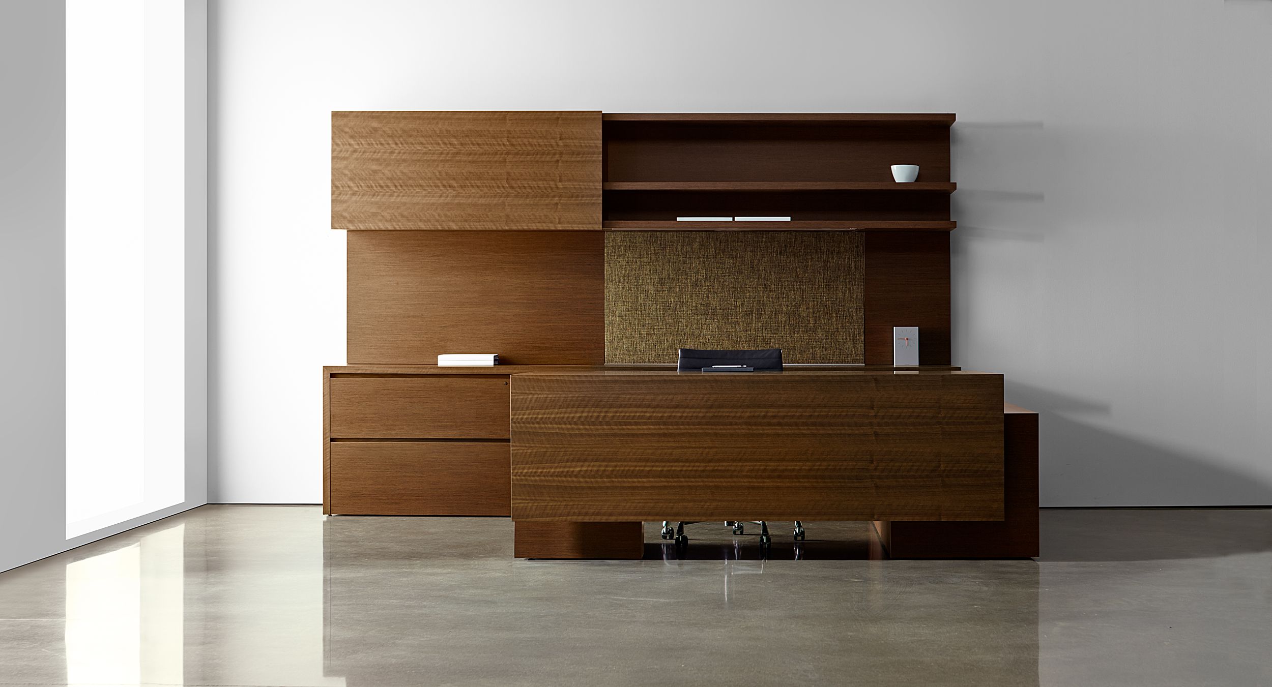 New Millennia cabinets feature smooth sliding doors and generous integral wood finger pulls.