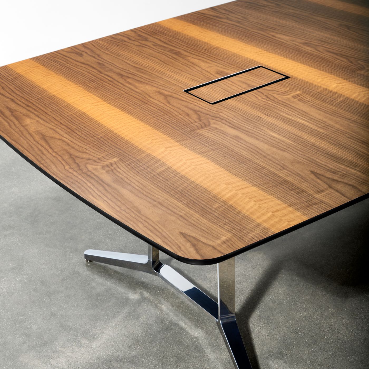 Power/data access doors are perfectly grain-matched to the table surface.