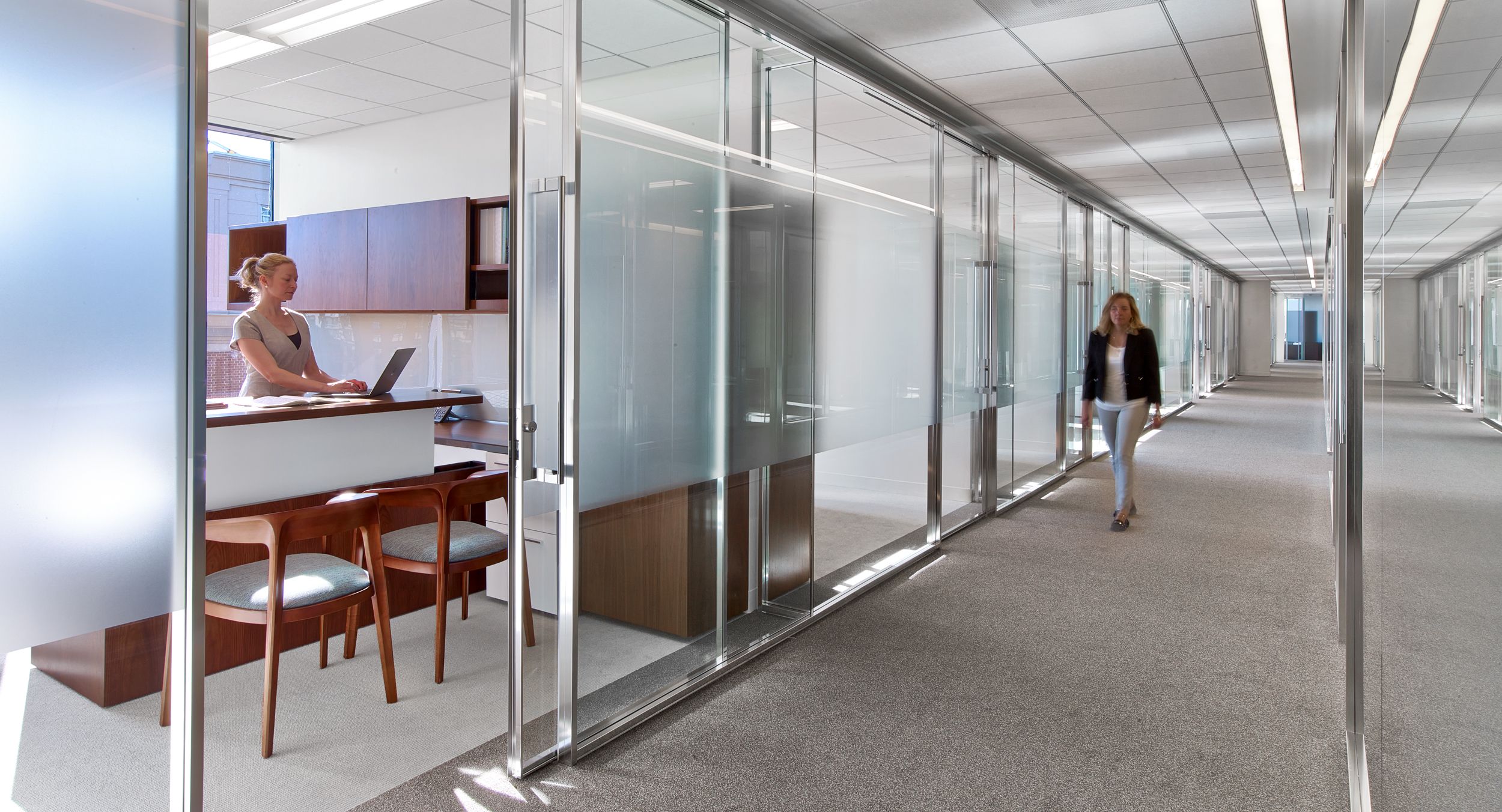 Associate offices feature integrated adjustable-height desking.