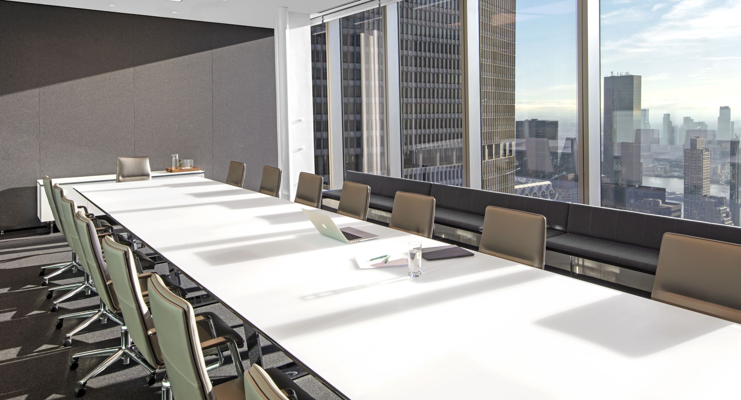 MESA conference table and signature credenza in etched white glass and polished chrome make a powerfully elegant statement.