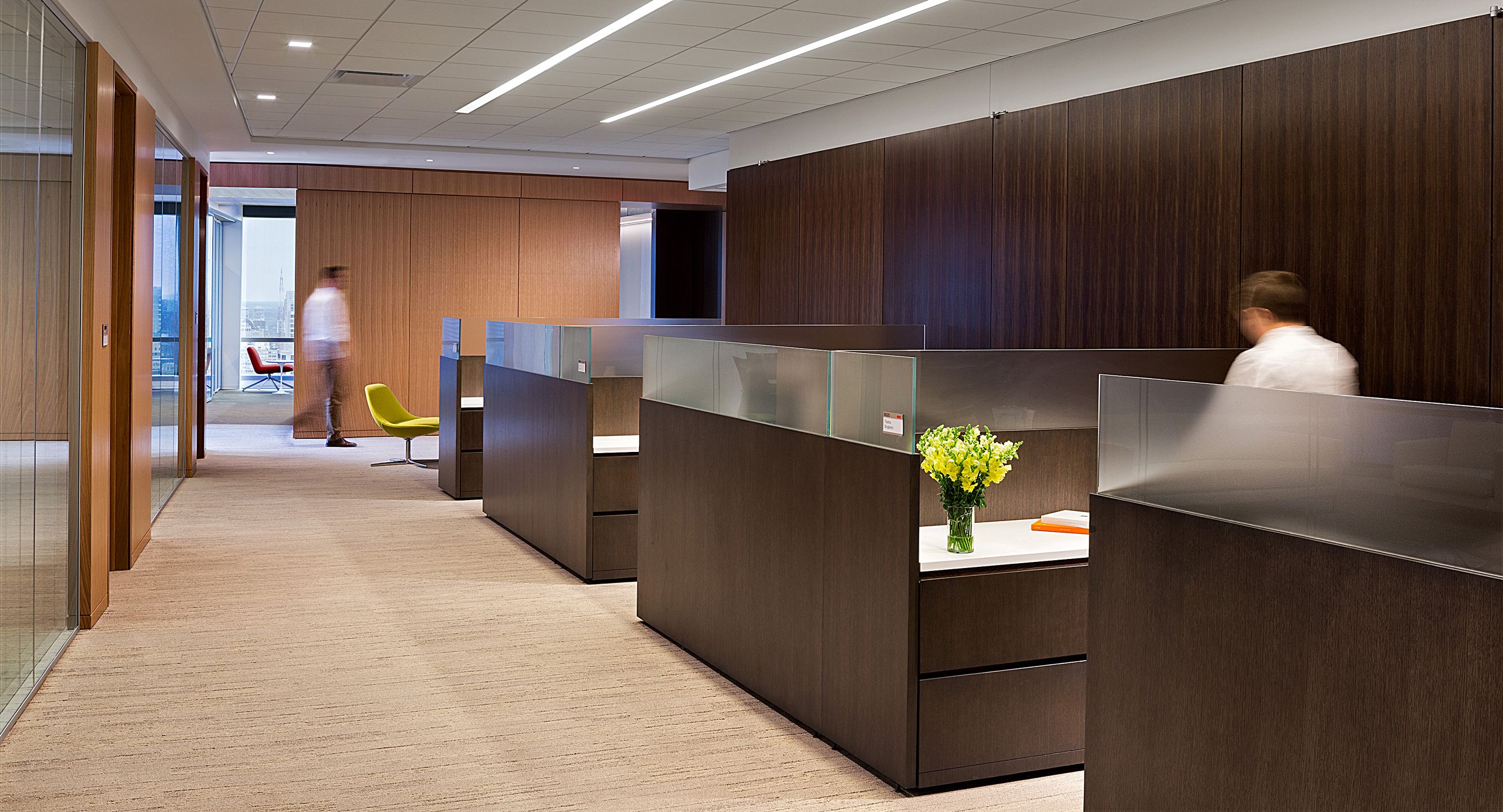 Rift cut veneers and etched glass create sophisticated administrative workstations.