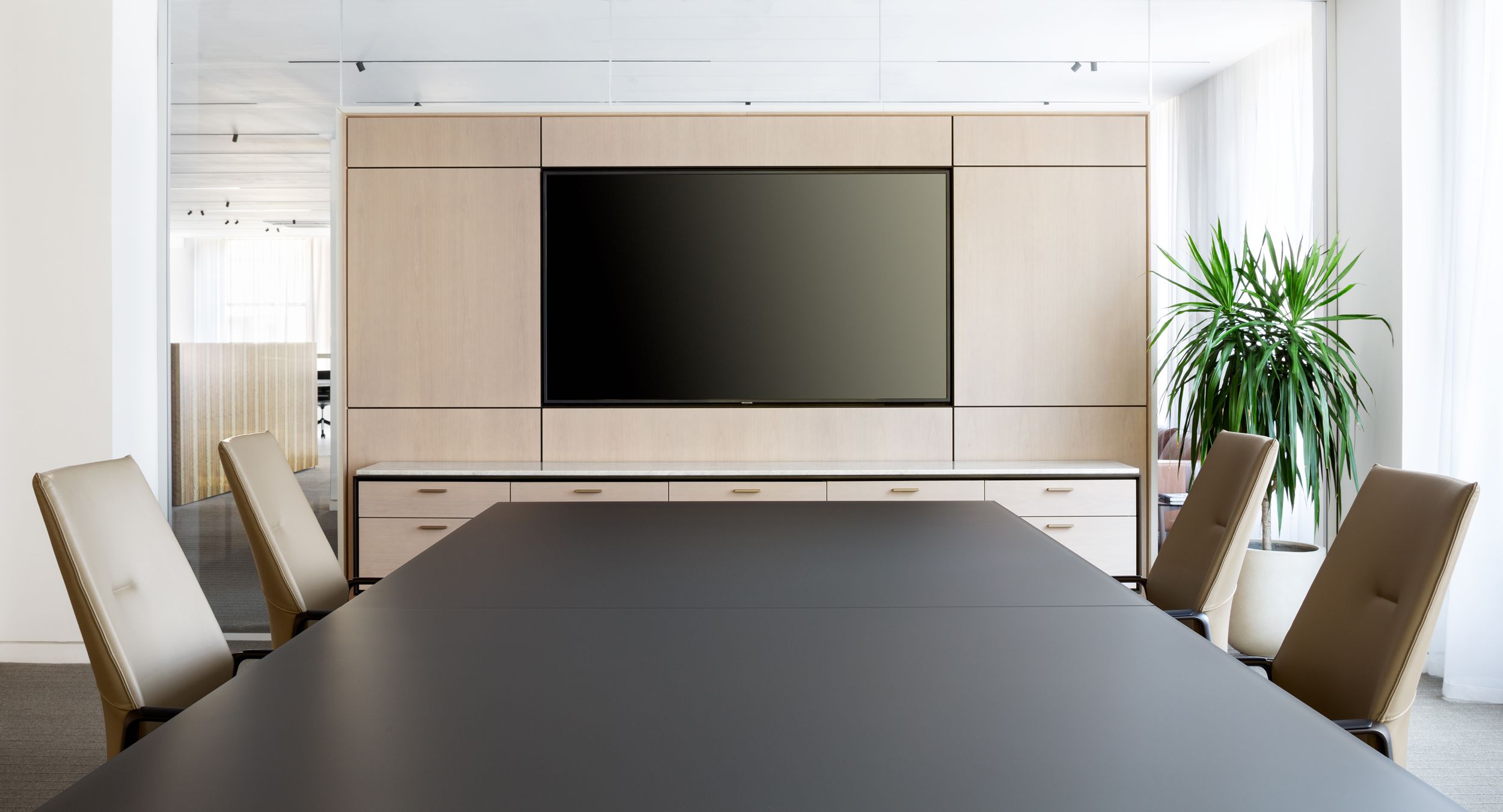 The Weathered Hickory media wall and HALO credenza with Taj Mahal marble are both beautiful and functional.