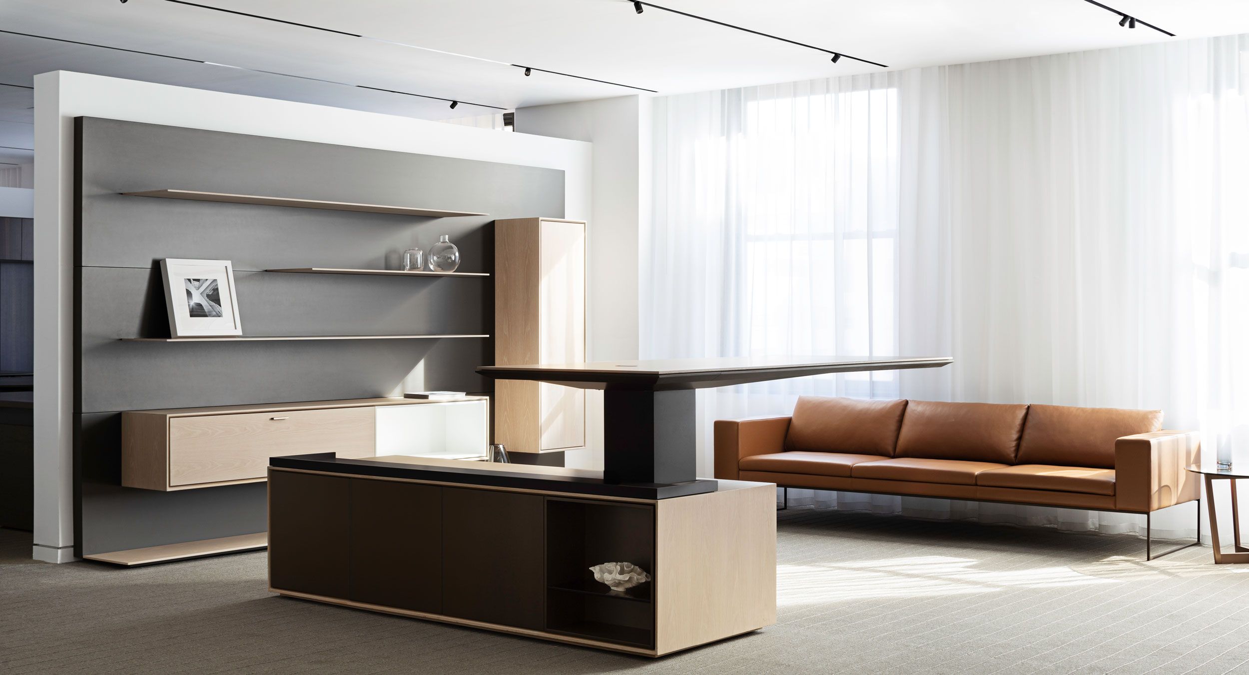 Defy gravity with the HALO cantilever adjustable-height desk.