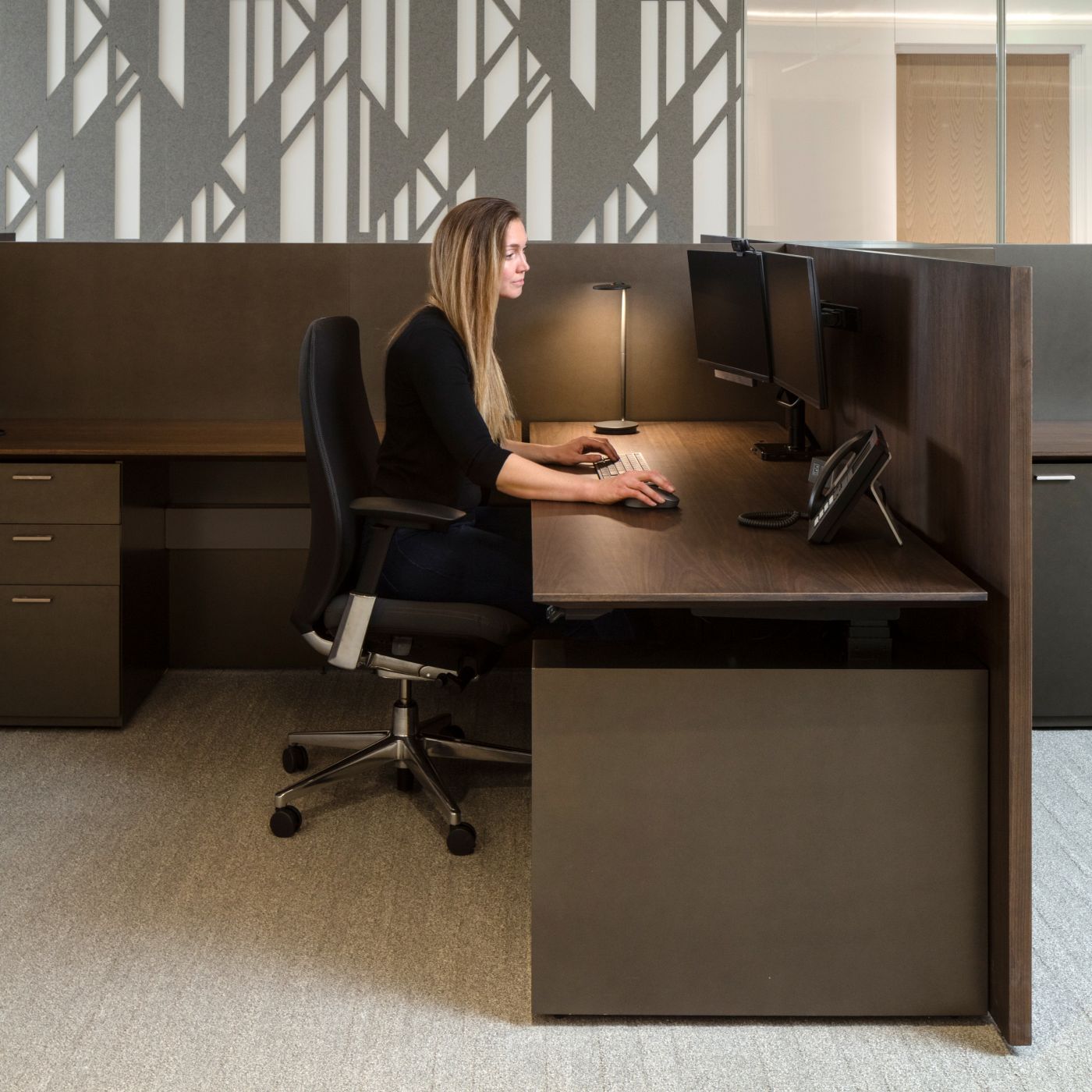 Spacious adjustable-height workstation offers a rich, amenity filled environment.