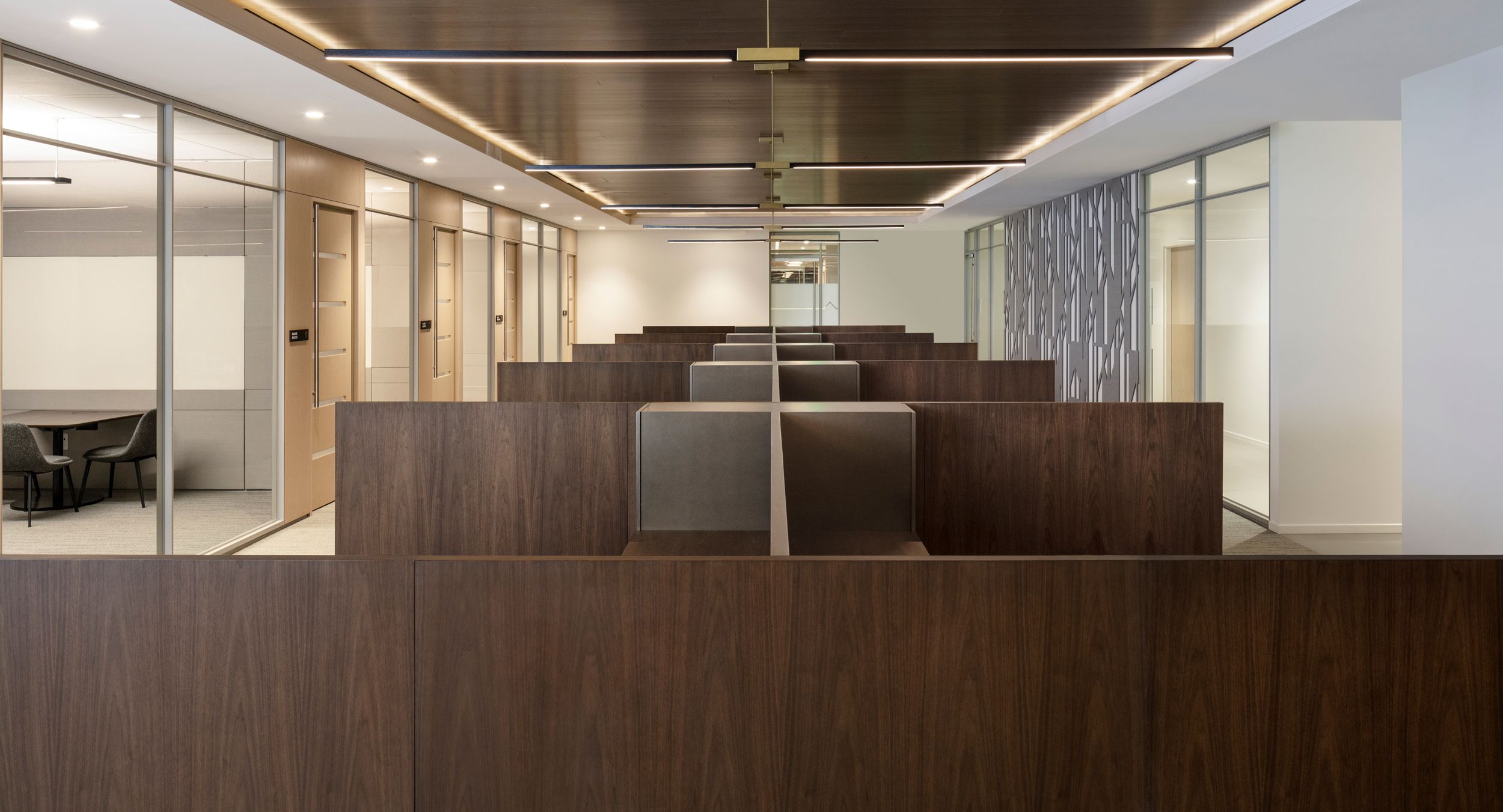 Open office workstations in beautifully sequenced matched smoked walnut.