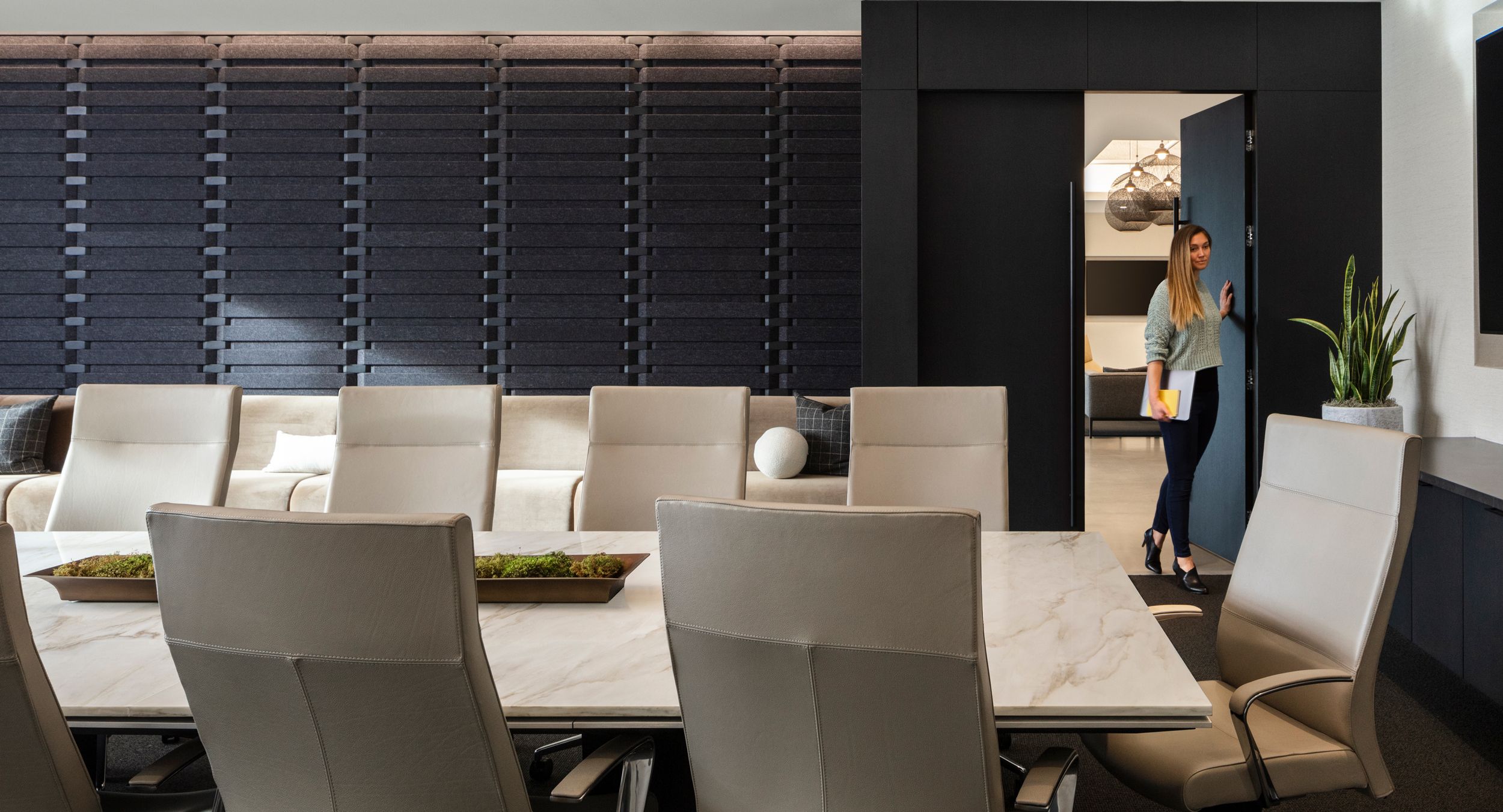 MESA table with Cremo Delicate stone surface, black oak drop edge and satin aluminum trim.