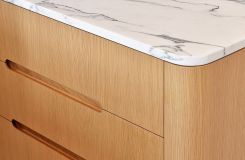 CREW credenza in white oak with a Calacatta Arabescato marble surface. thumbnail