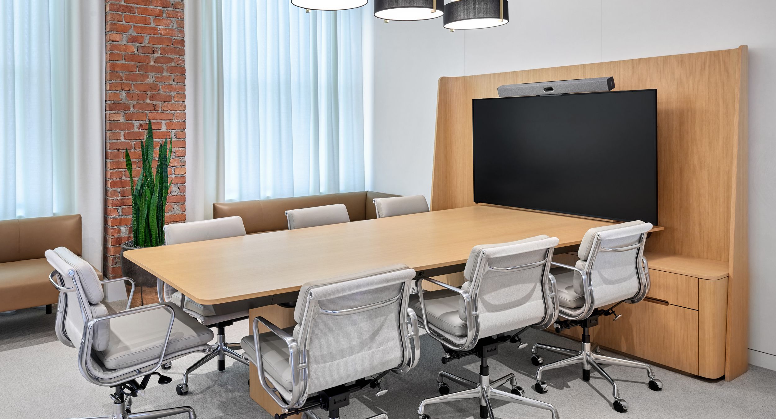 Adjustable-height CREW media table in white oak and deep bronze.