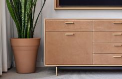 HALO credenza with brushed brass finger pulls and base with custom leather faces. thumbnail