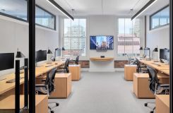 Custom HALO OFFICE workstations in white oak with deep bronze finger pulls. thumbnail