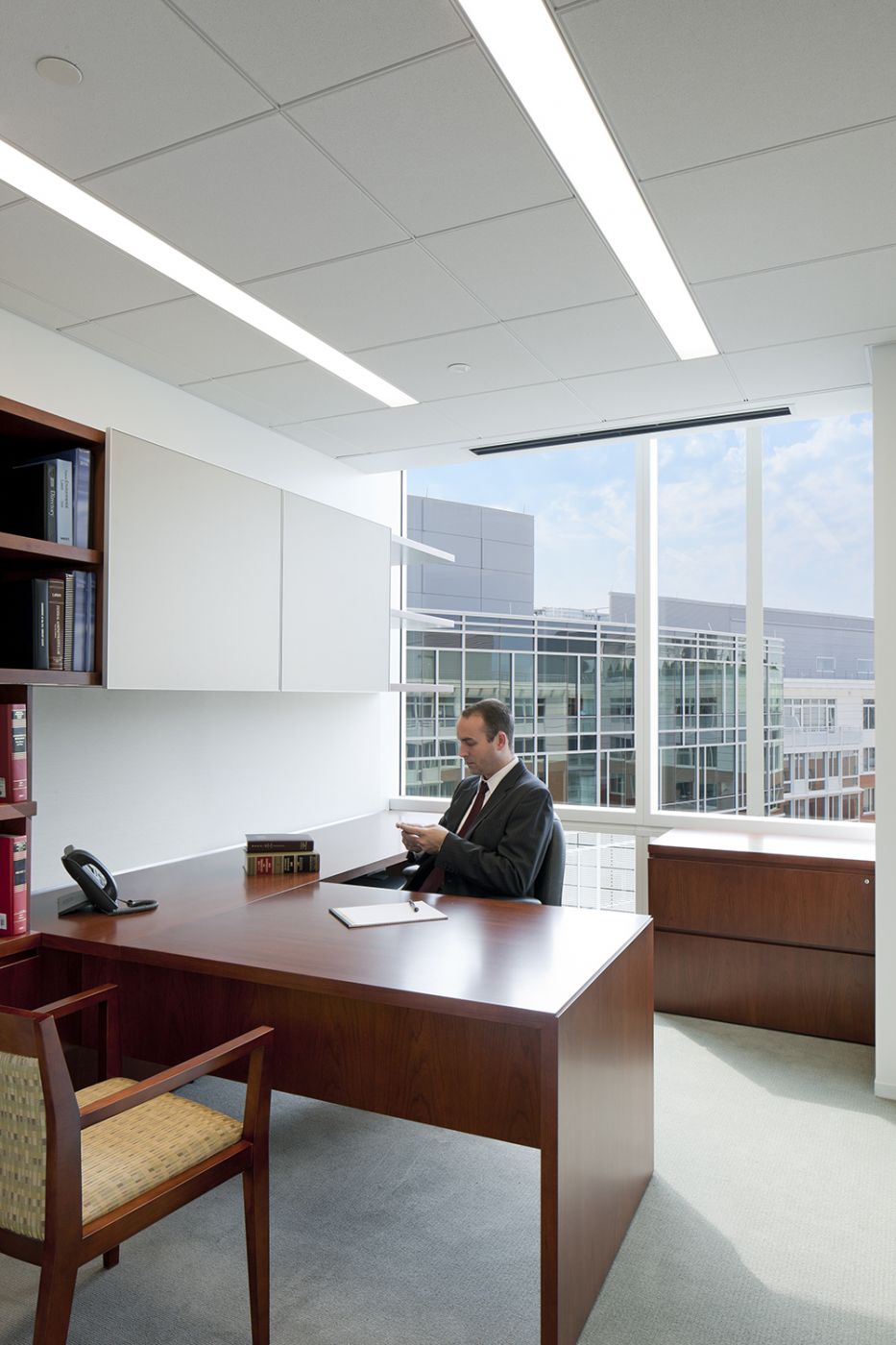 NEW MILLENNIA attorney offices are finished in Flat Cut Cherry with etched glass sliding overhead doors.