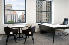 Private offices feature White Corian and glass paired with bronze table legs. thumbnail