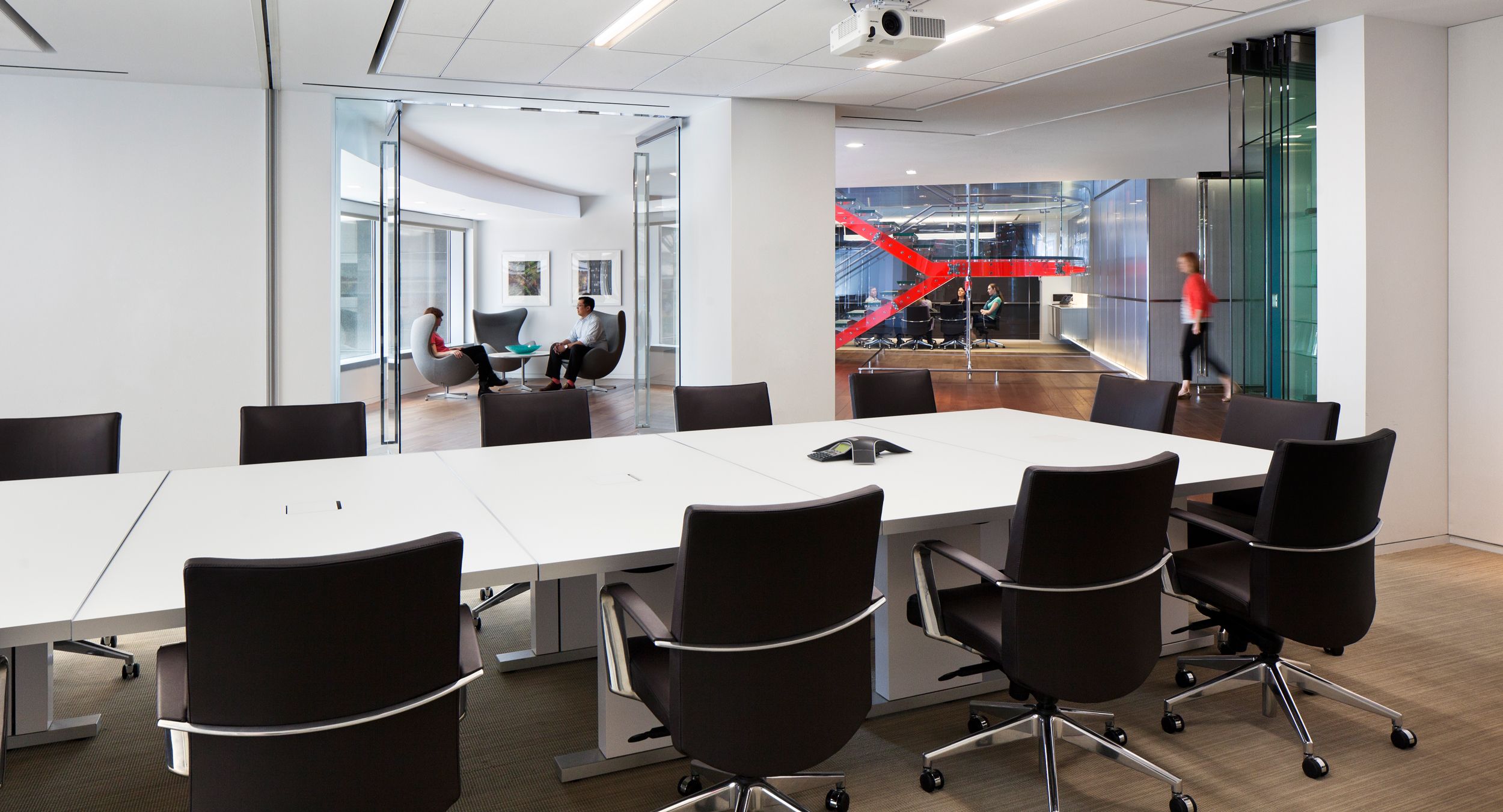 MOTUS tables in etched white glass create conference space that is beautiful and flexible.