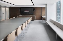HALO benching and stone top credenza enhance the elegant tone of this meeting space. thumbnail