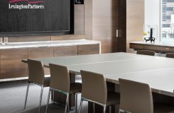 Luxurious finishes like the back-painted etched glass MOTUS surfaces and Calacatta stone topped HALO credenza are centerpieces of this sophisticated space. thumbnail