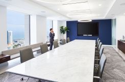 HALO storage and gallery seating complement a stunning MESA table in stone and chrome. thumbnail