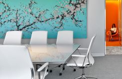 Glass MESA tables provide a beautiful, clean meeting surface for this colorful office. thumbnail