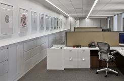 Open plan workstations feature white laminate and casework resulting in a beautiful, clean, and modern aesthetic. thumbnail