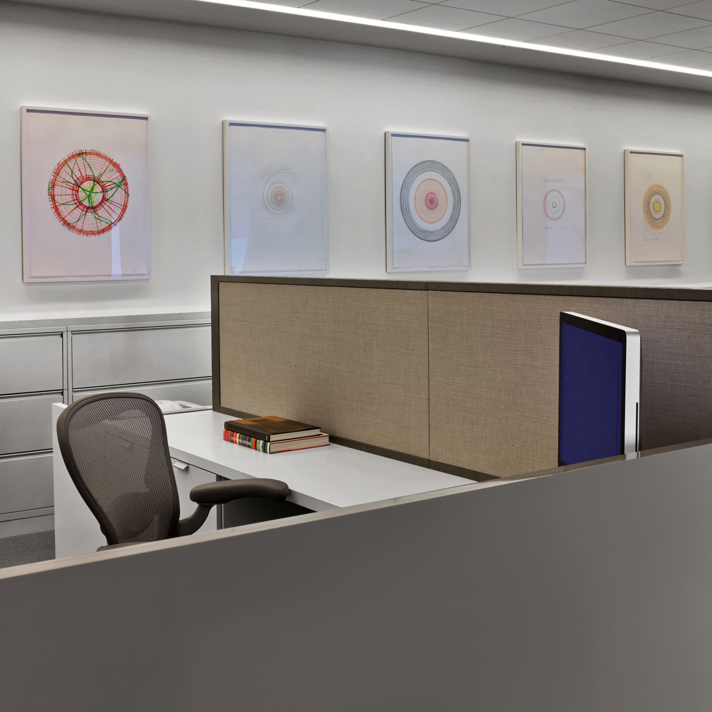 Open plan workstations feature white laminate and casework resulting in a beautiful, clean, and modern aesthetic.