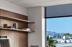 Private offices feature rift oak workwalls, Smoky White laminate surfaces, and brushed aluminum hardware. thumbnail
