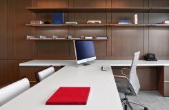 Private offices feature rift oak workwalls, Smoky White laminate surfaces, and brushed aluminum hardware. thumbnail