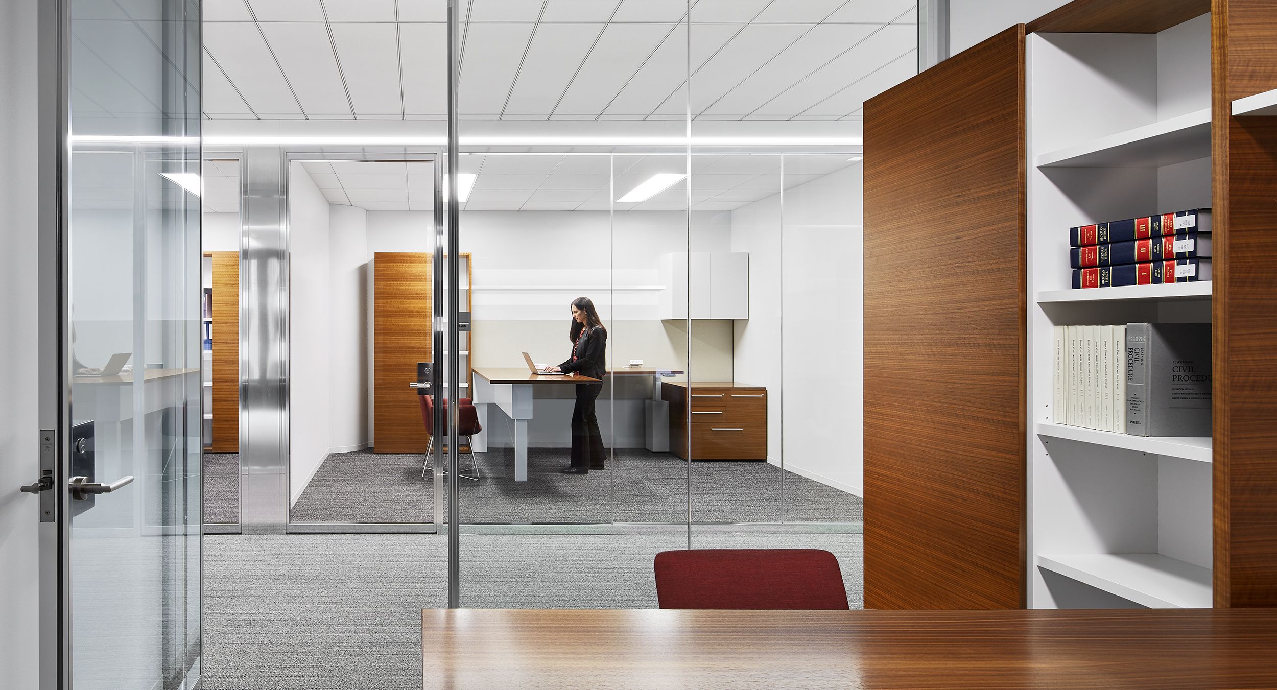 Adjustable-height desking is beautifully integrated into every office.
