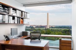 Attorney offices in Quarter Cut Elm veneer feature a height-adjustable surface at the window.  thumbnail