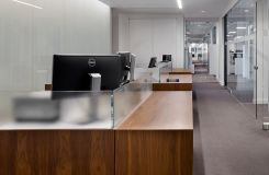 Open office workstations were provided in Flat Cut Walnut and etched glass. thumbnail